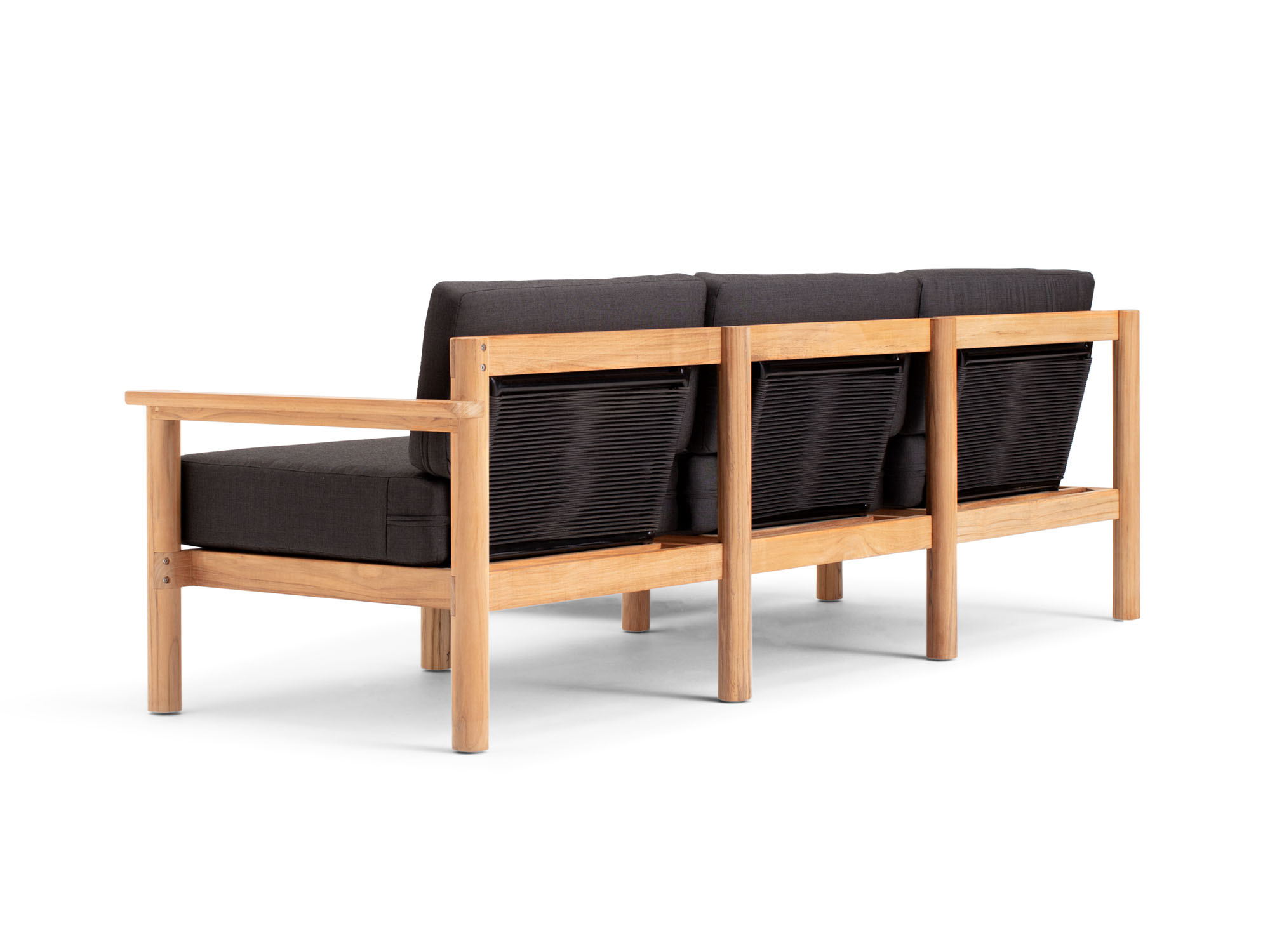Back angle view of 4-piece outdoor sectional with black cushions